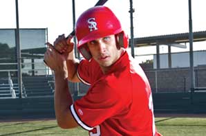 Portrait of Gary Apelian in position to swing his bat