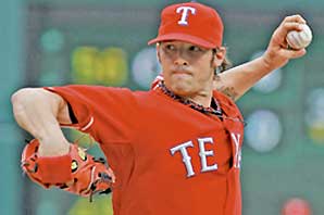 Texas Ranger pitcher C.J. Wilson in position to pitch a ball