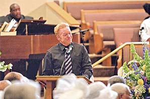 Professor Lance Lockwood almost in tear while giving eulogy at church.