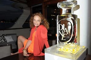 Diane von Furstenberg sitting next to her self-titled fragrance