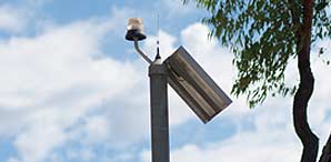 One of the security camera position at top of a tall pole.