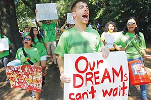 Supporters of Dream Act carrying banners such as "Our Dreams Can't Wait"