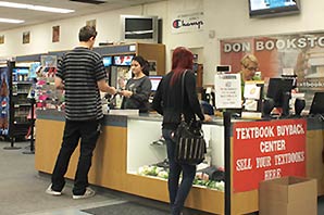 Students paying for their merchandise at Santa Ana College Don's bookstore registers.