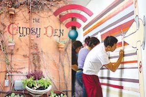 A montage of: Photo of several art student painting the wall inside Fine Art Building next to the Art Gallery, the wall of the Gypsy Den surrounded by plants, and the WiFi symbol.