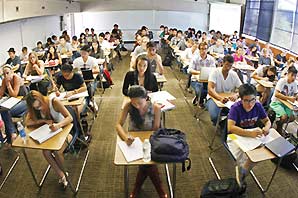 View of a classroom from the instructor desk with a very packed classroom of about 65 students.