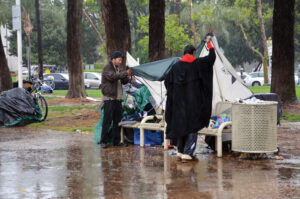 Downpour / The homeless build makeshift tents outside Santa Ana’s Civic Center, surrounded by the Ronald Reagan Federal Courthouse and City Hall.  / R. Nicanor Santana / el Don