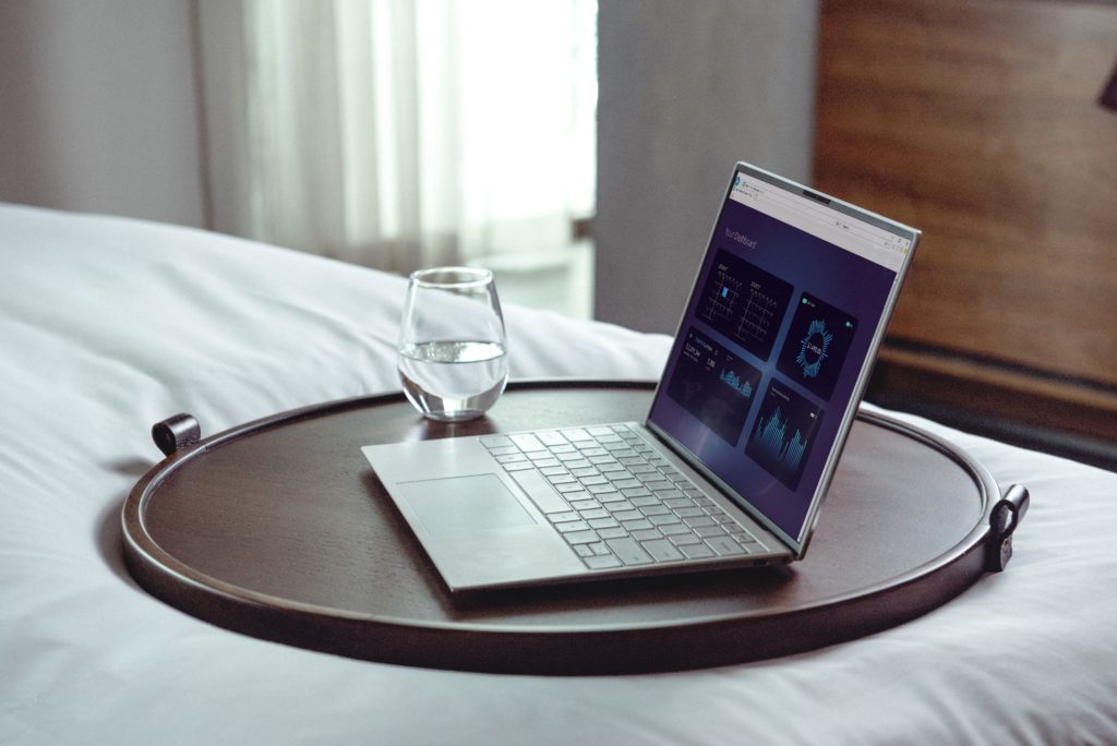 laptop on brown wooden table