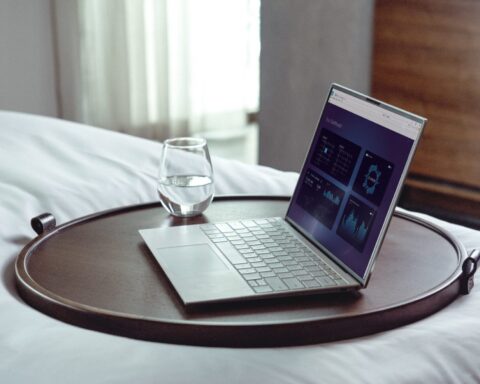 laptop on brown wooden table