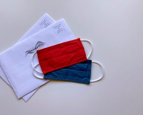 red and blue pouch on white paper