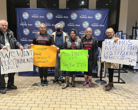 Business owners protesting at city council meeting.
