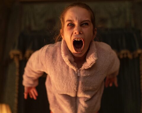A girl with pointed teeth screaming
