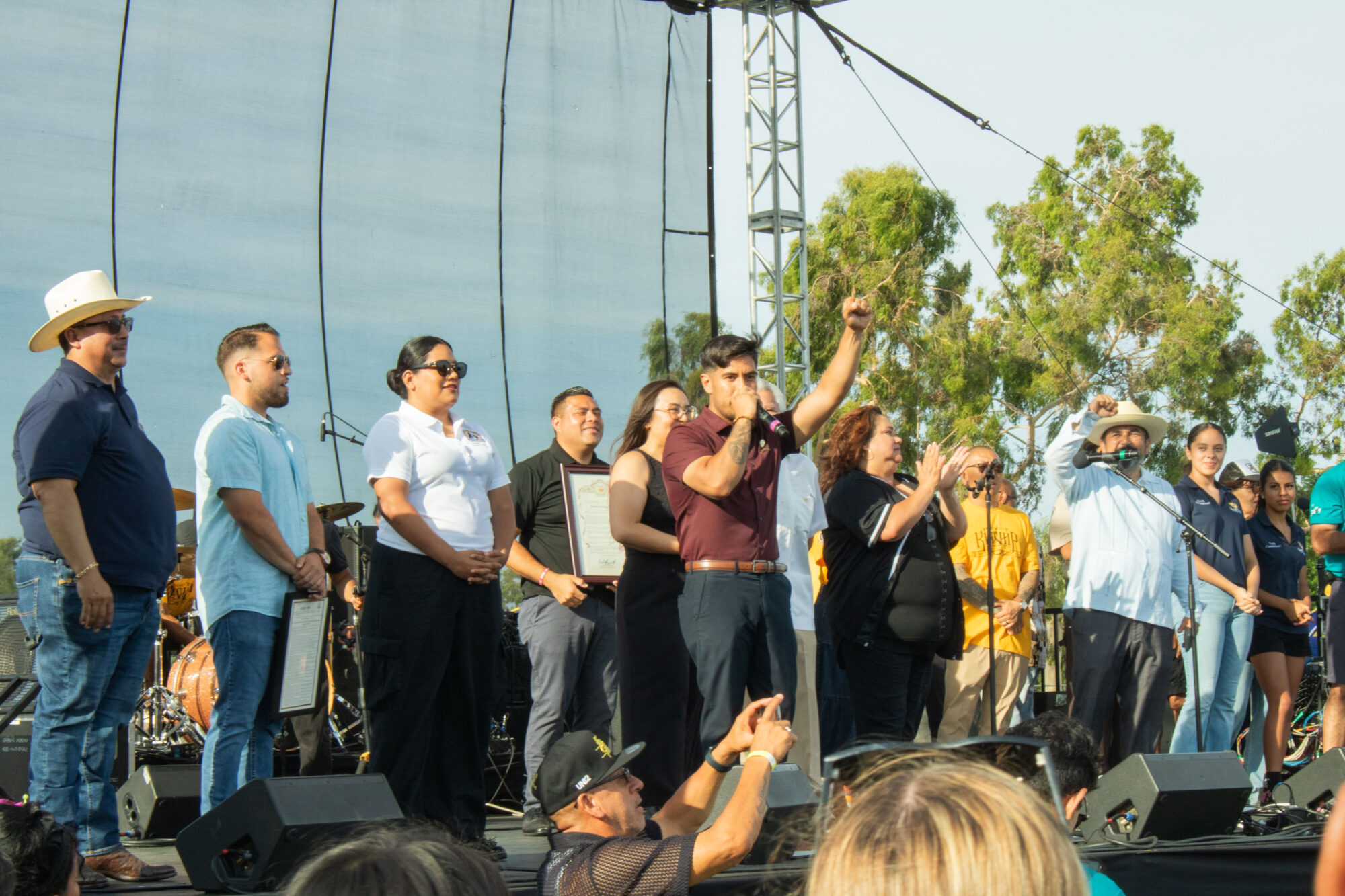 A city councilman standing on a stage giving a speech