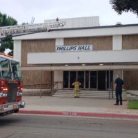 Fire officials and campus security in front of Phillips Hall