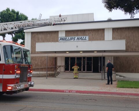 Fire officials and campus security in front of Phillips Hall