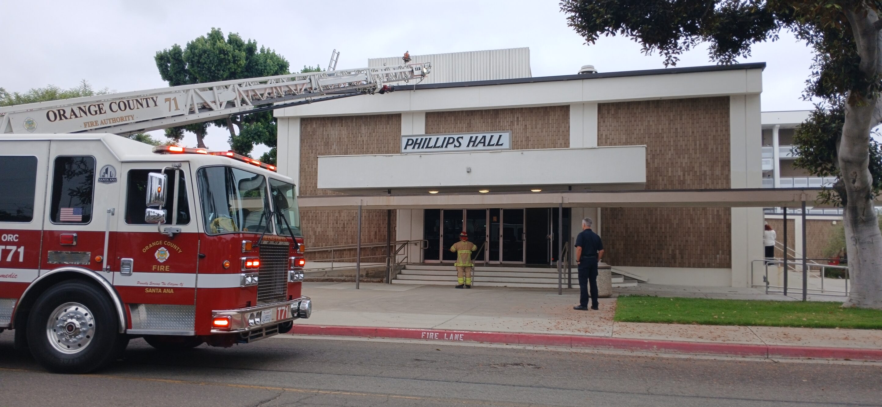 Fire officials and campus security in front of Phillips Hall