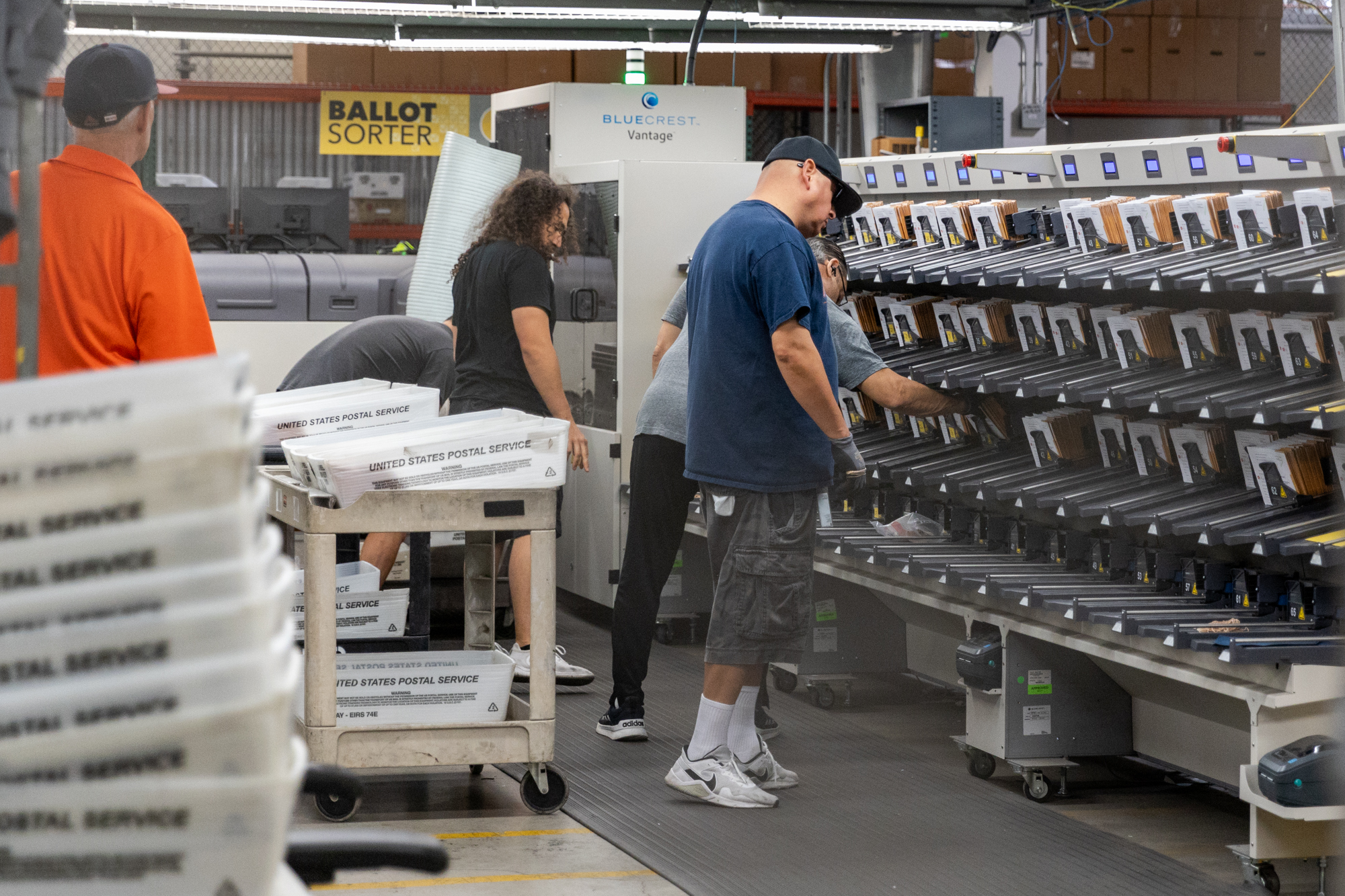 Ballots being scanned sorted and