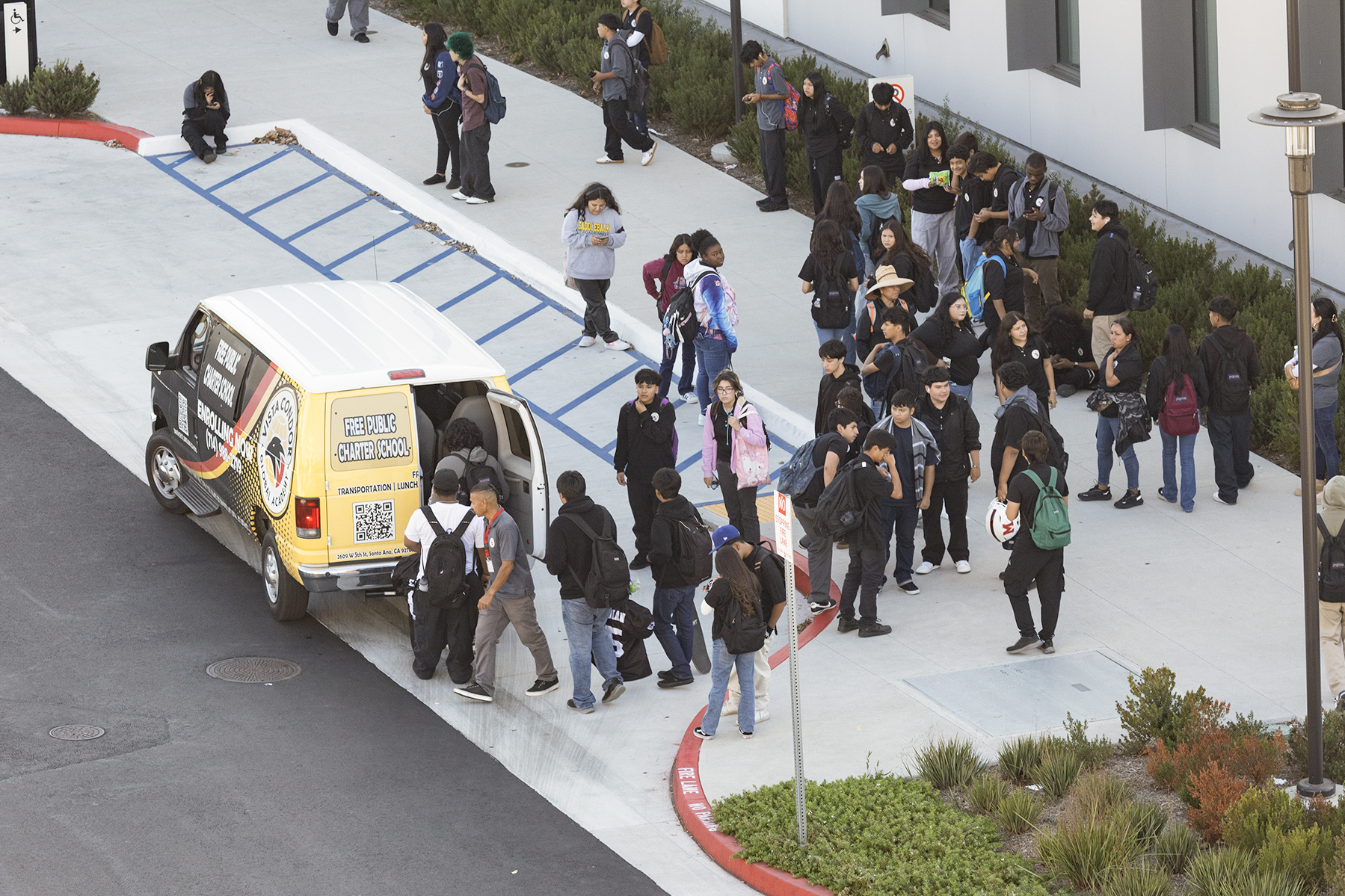 Vista Meridian students getting into a school van after school