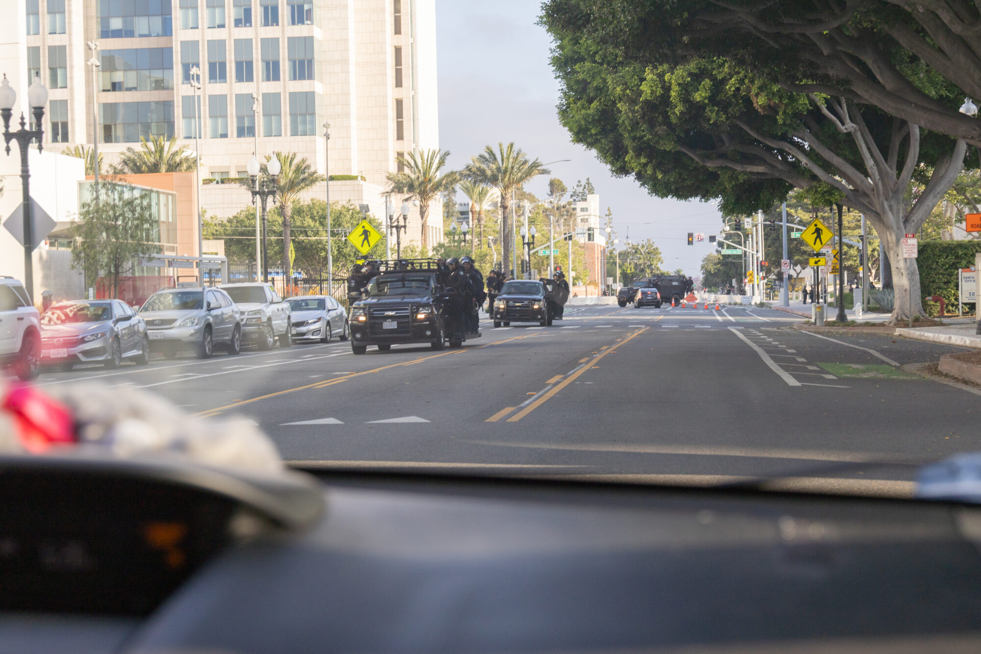 police trucks driving through Santa Ana