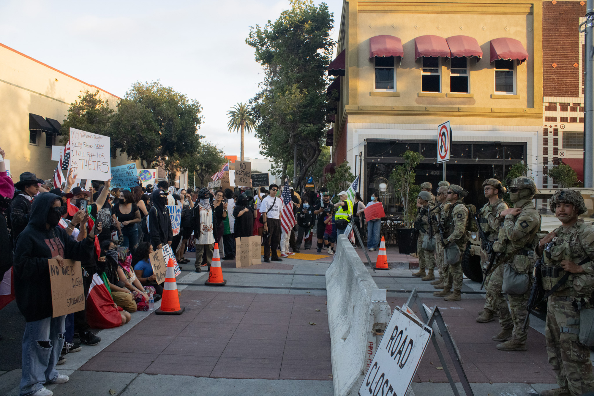 Protesters are separated from National guard by a barrier