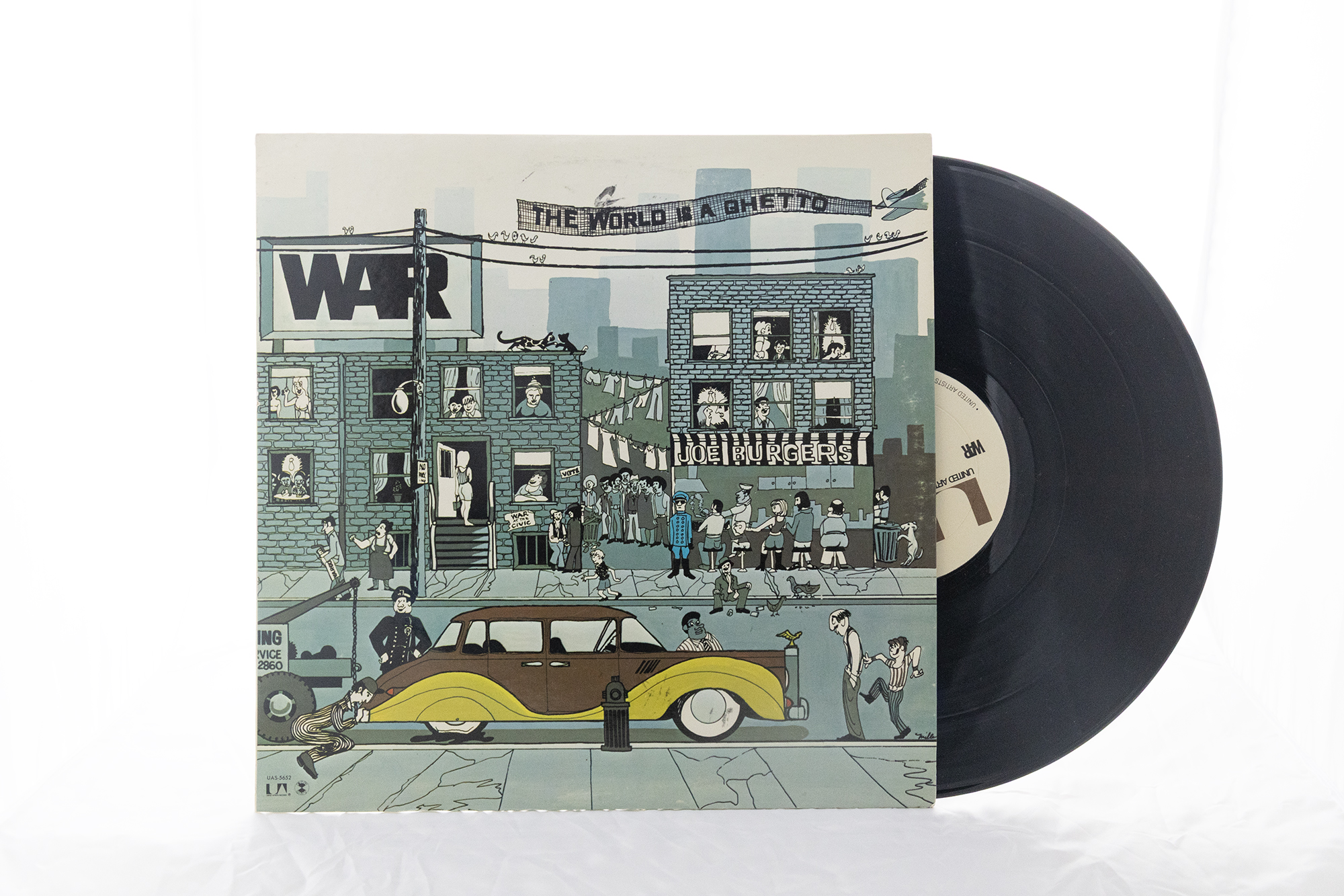 A vinyl record halfway out of its sleeve